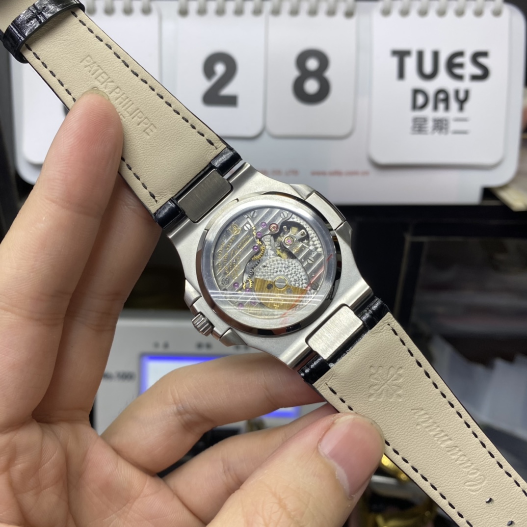 Patek Philippe Nautilus series 5712G-001, Stainless Steel Case Grey Dial Black Leather Strap, 40mm size.