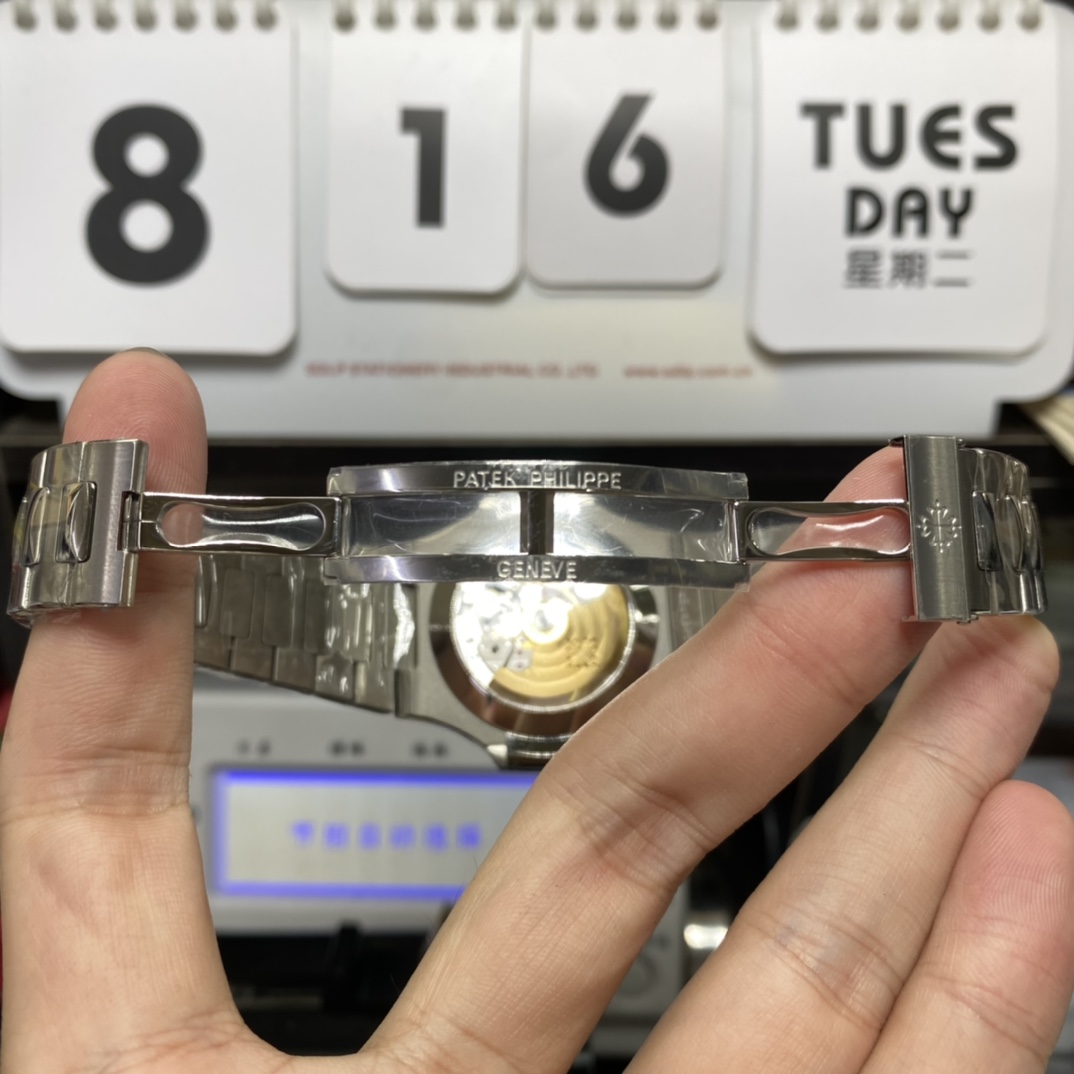 Patek Philippe Nautilus series 57261A-014, Blue Dial Steel Bracelet, Moon Phase Calendar Central Month and Week Display, 40.5mm Size.