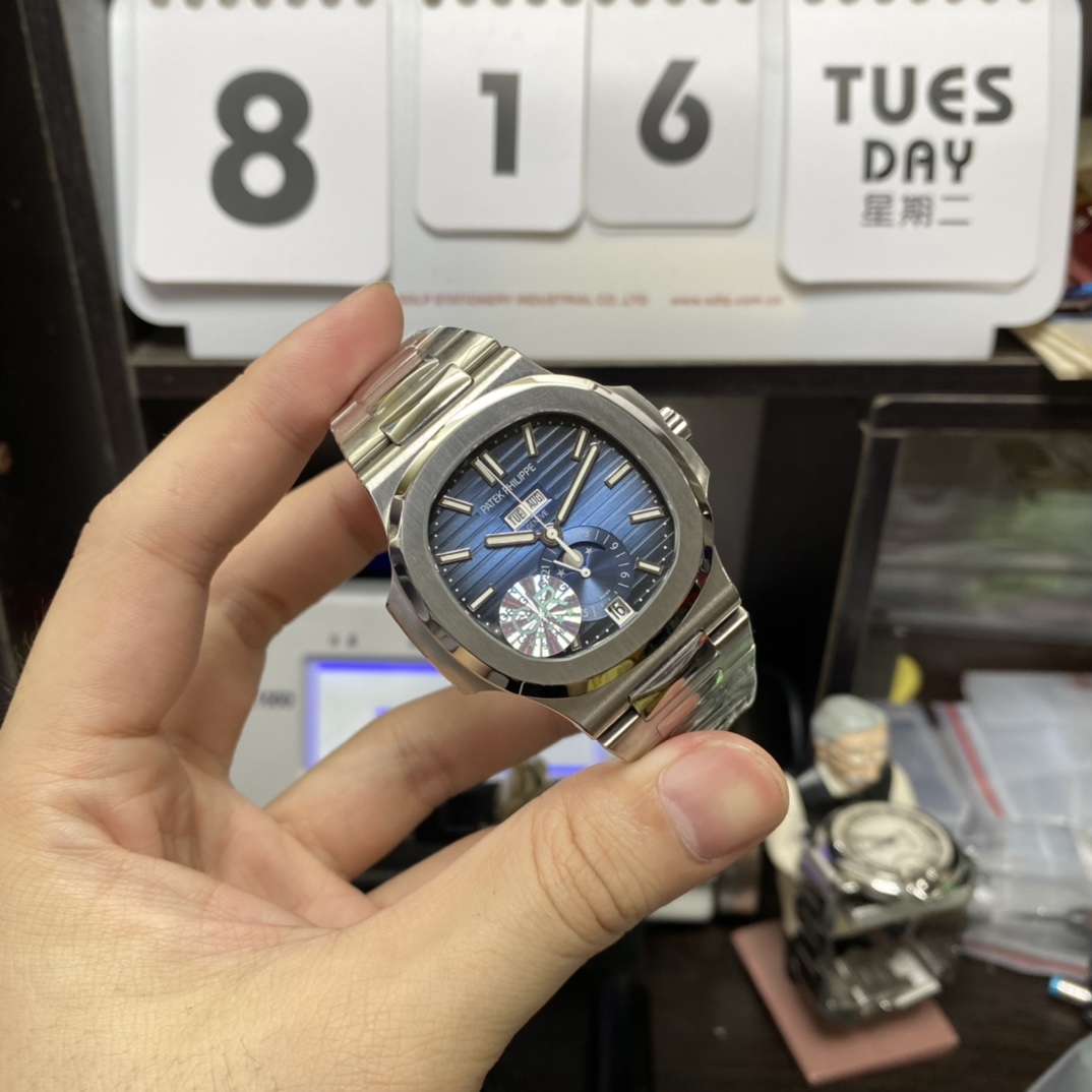 Patek Philippe Nautilus series 57261A-014, Blue Dial Steel Bracelet, Moon Phase Calendar Central Month and Week Display, 40.5mm Size.