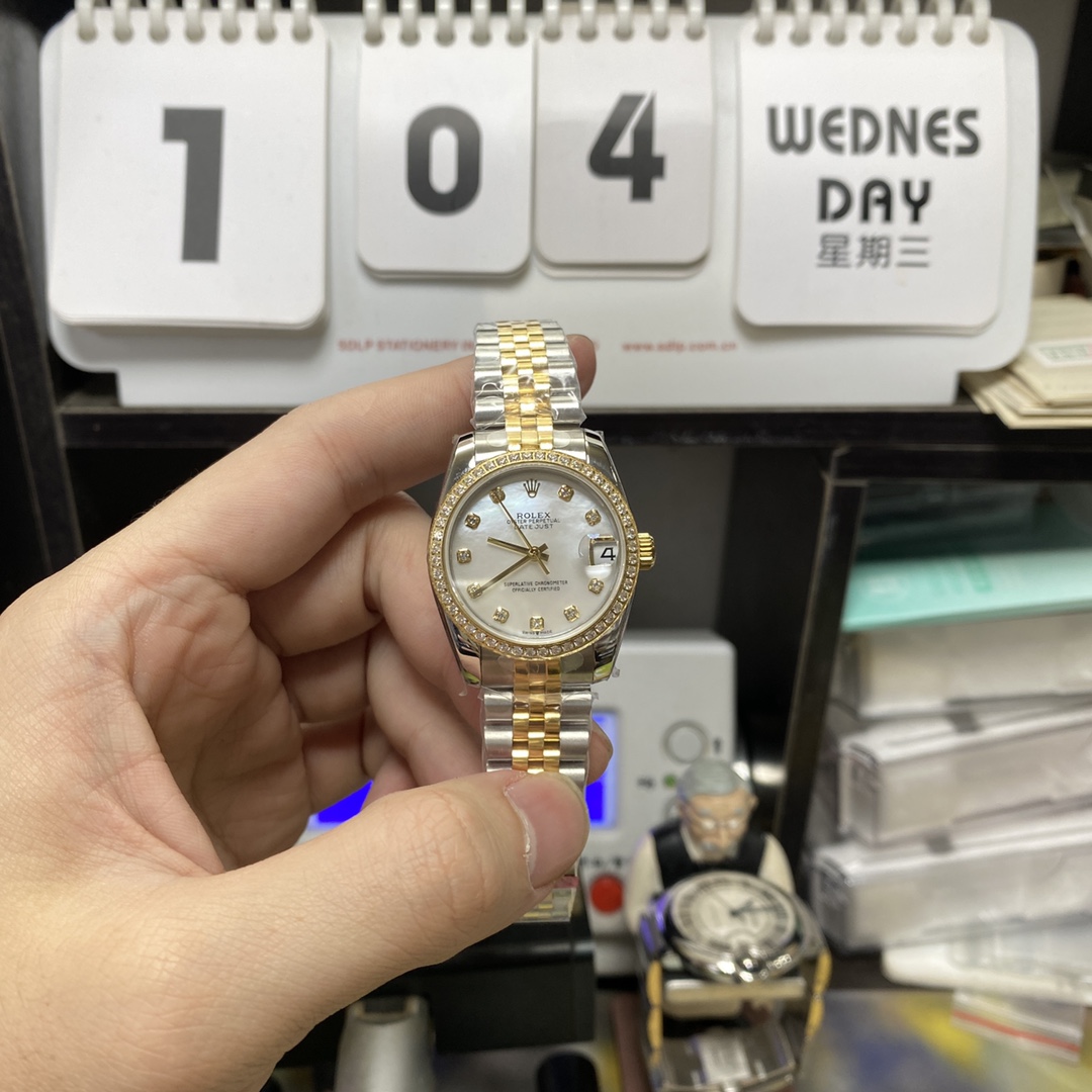 Rolex Datejust Series m278383rbr-0028, Two-Tone Gold Case with Mother-of-Pearl Dial and Diamond Bezel, 31mm size, Jubilee stainless steel bracelet.