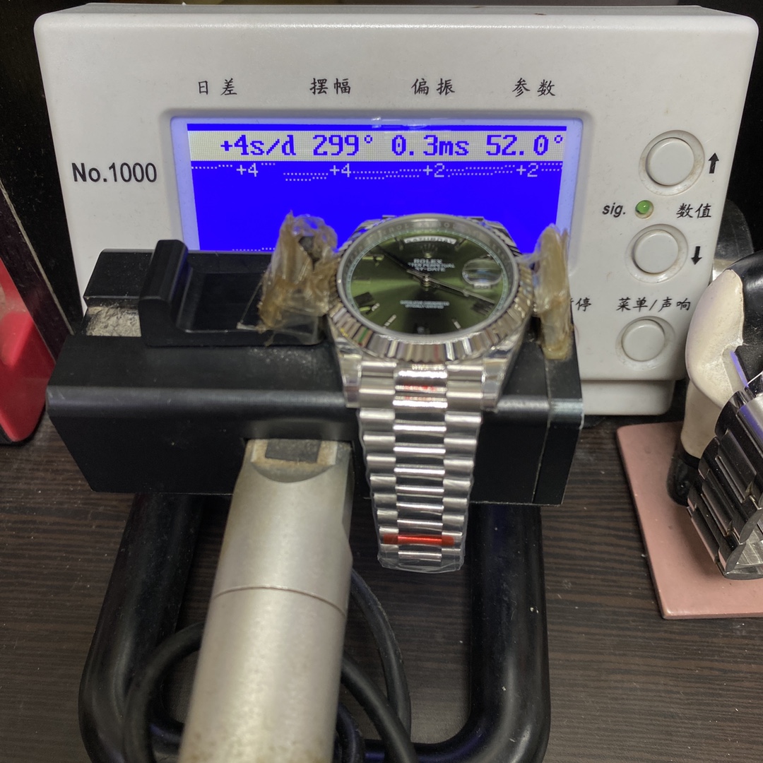 Rolex Day-Date series m228239-0033, Silver Case Olive Green Dial with Roman Numeral Markers, Instantaneous Day and Date Functions, 40mm Size.